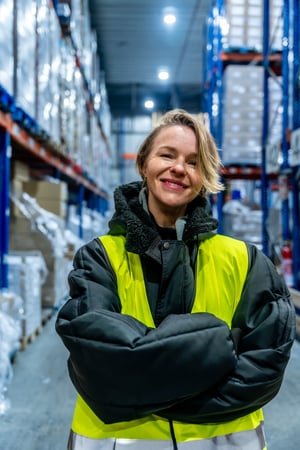 women in warehouse wearing high-vis